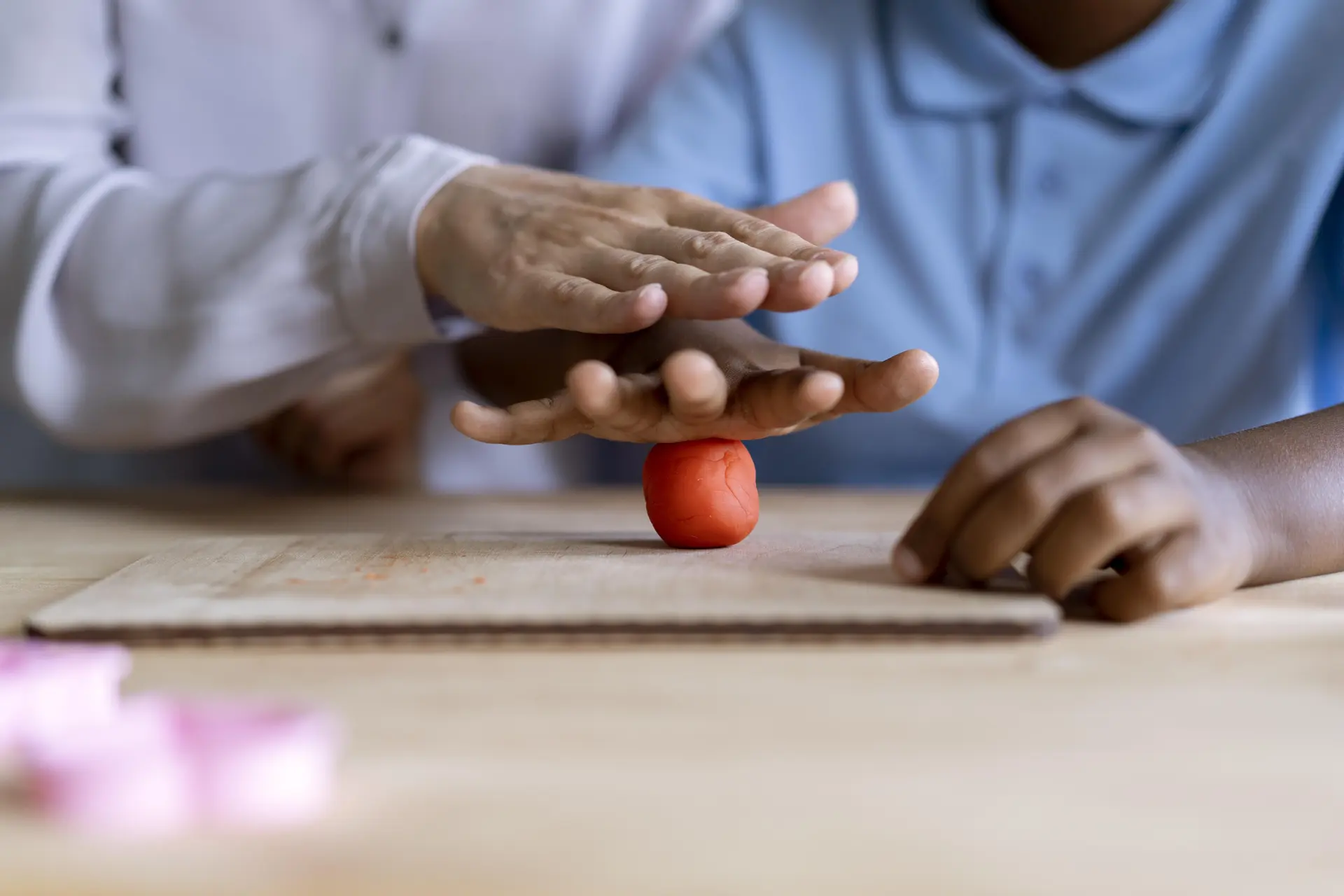 Occupational therapist helping a patient with fine motor skill exercises.